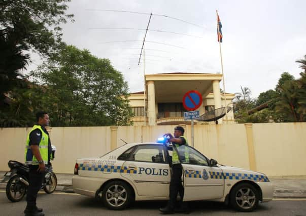 Malaysian police officers guard outside the North Korean Embassy in Kuala Lumpur. Picture: AP Photo/Daniel Chan