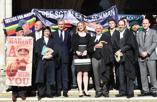 Claire Blackman, the wife of Sgt  Alexander Blackman, with supporters, outside the High Court in London. Picture:  Lauren Hurley/PA Wire