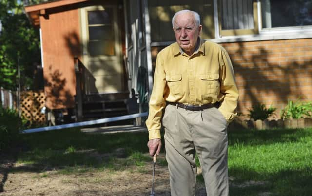 Michael Karkoc works in his yard in Minneapolis in 2014 (Richard Sennott/Star Tribune via AP)