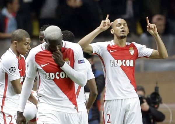 Monaco's Fabinho, right, celebrates his side's second goal against Manchester City at the Stade Louis II. Picture: AP Photo/Claude Paris