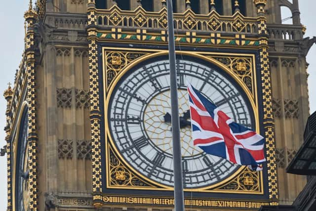 Union flags fly at half-mast in front of Big Ben as a mark of respect for the victims of the March 22 terror attack. Picture: AFP/Getty Images