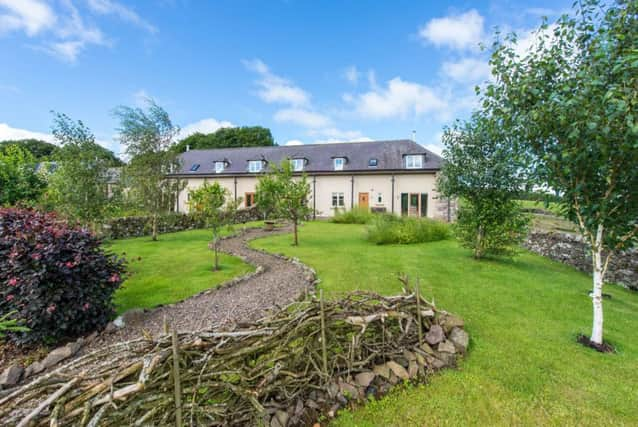 The pretty landscaped gardens enhances 1, The Steadings, near Jedburgh