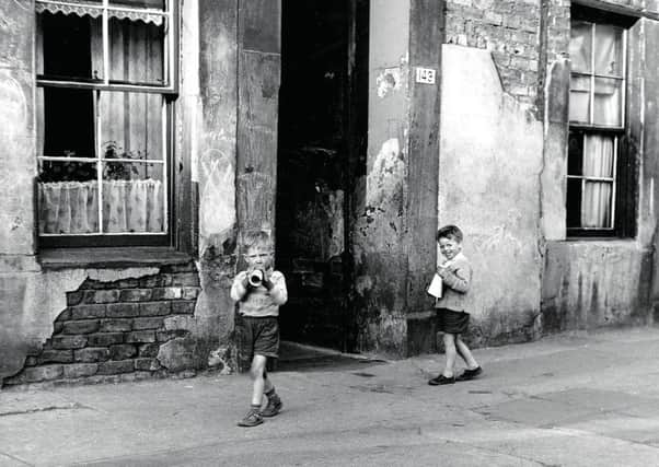 Deprivation of the kind once seen in the Gorbals is a thing of the past, but statistics show that the life chances of Scots today are far from equal. Picture: B Marshall/Getty