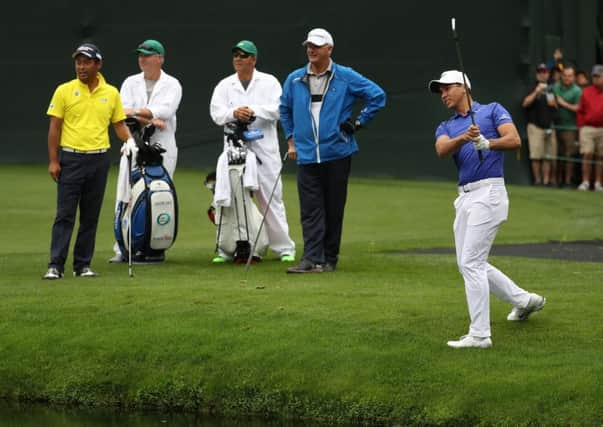 Scotland's Sandy Lyle watches on as world No 3 Jason Day plays a shot on the 16th hole during practice at Augusta yesterday. Picture: Rob Carr/Getty