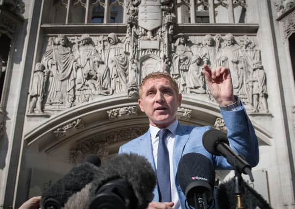 Jon Platt speaks to the media outside the Supreme Court in London. He said he was not at all surprised by the judgment. Picture: PA