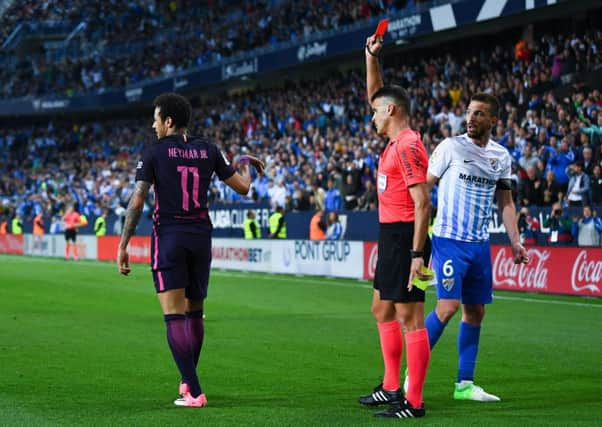 Neymaris sent off during Barcelonas 2-0 defeat by Malaga on Saturday. Picture: Getty.