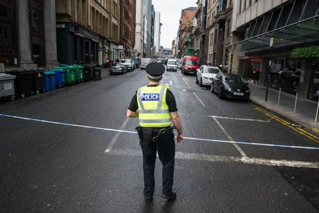 Police sealed off the road (Photo: John Devlin)