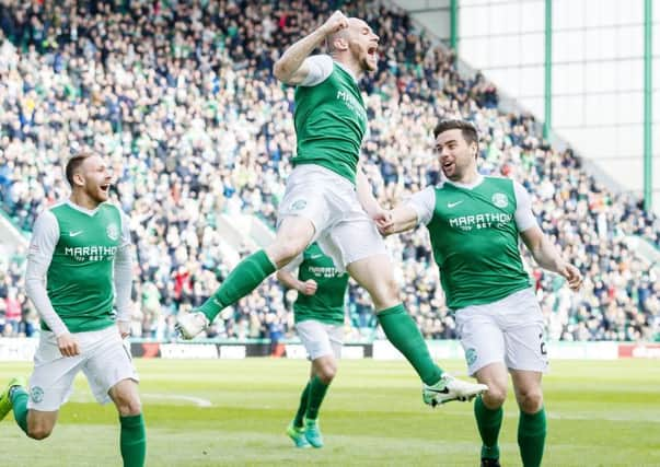 David Gray celebrates Hibs' third goal. Pic: SNS/Roddy Scott