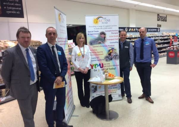 Simon Wetherell, Co-op Director of Facilities Management; Divisional Managing Director John McNeill; Chrisetta Mitchell, The Leanne Fund; Macaulay Road Store Manager, Steven Cooper and Cromwell Street Store Manager Steven Macphail. Picture: Contributed