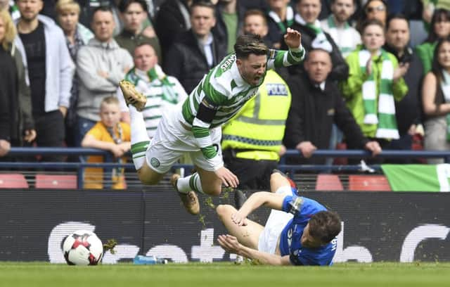 Patrick Roberts is hacked down by Rangers midfielder Andy Halliday. Picture: SNS