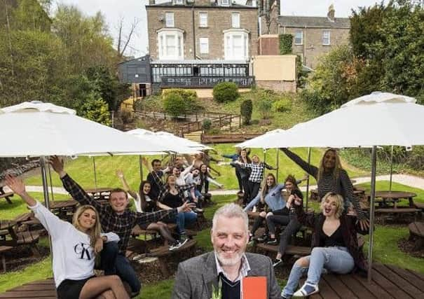 Philanthropist Garreth Wood opens the newest Boozy Cow in Dundee. Picture: Alan Richardson