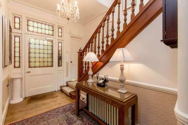 The front hall and traditional staircase