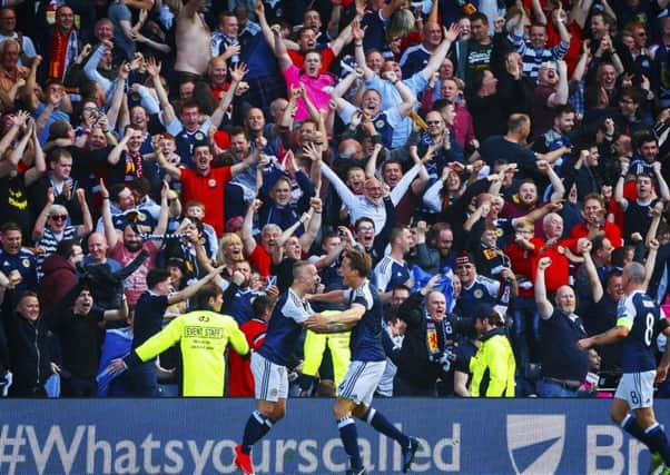 Leigh Griffiths celebrates after he scores a free kick to put his ahead. Picture: SNS/Roddy Scott