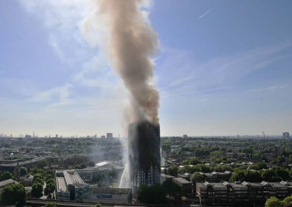 Smoke billows from a fire that has engulfed the 24-storey Grenfell Tower in west London.  Picture: Victoria Jones/PA Wire