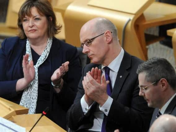 John Swinney is to hand  headteachers more control in schools