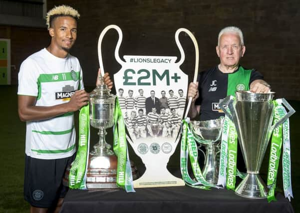 Celtic's Scott Sinclair and Lisbon Lion John Clark make the announcement that the Lions Legacy has raised Â£2 million for the Celtic Foundation. Picture: Alan Harvey/SNS