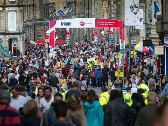 Hundreds of performers stage free shows every day on the Royal Mile and The Mound during the Fringe.