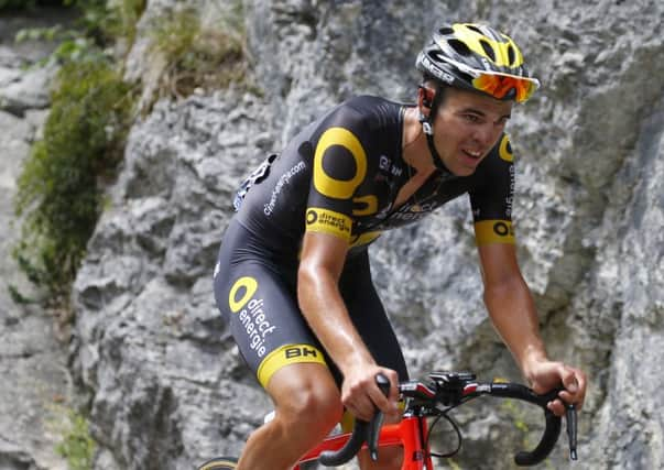 Stage winner and new best climber Frances Lilian Calmejane during the eighth stage to the Rousses ski station in the Jura Massif. Photograph: Peter Dejong/AP