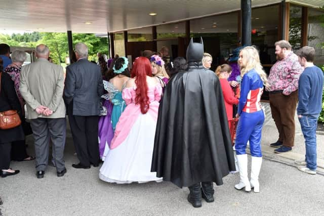 Hundreds attended the five-year-old's funeral with many dressing in superhero costumes or bright pink dresses in her honour. Picture: SWNS