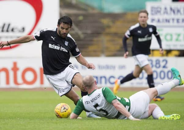 Dundee's Sofien Moussa battles for the ball against Buckie Thistle's Lewis Mackinnon. Picture: SNS/Kenny Smith