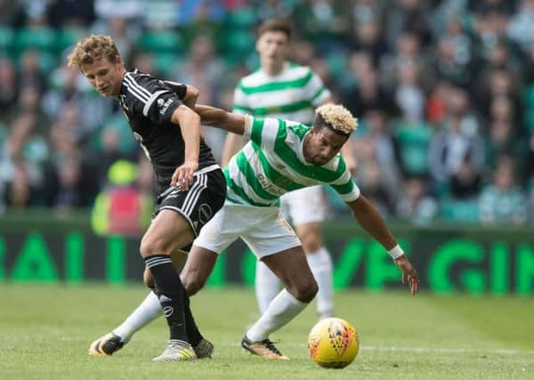 Scott Sinclair of Celtic pushes off Vegar Eggen Hedenstad. Picture: Steve Welsh/Getty Images