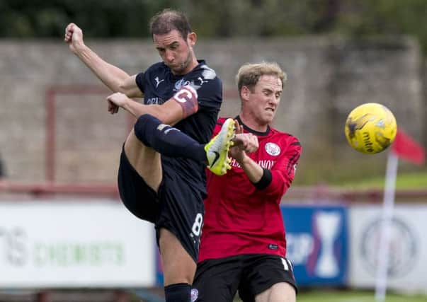 Falkirk's Mark Kerr (L) in action against Euan Spark. Picture: SNS/Craig Williamson