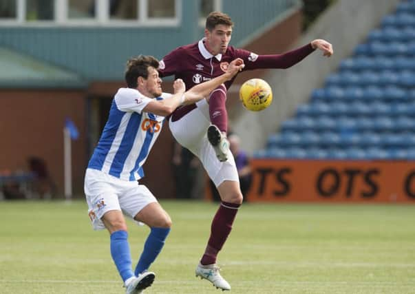 Kilmarnocks Gordon Greer  challenges Kyle Lafferty of Hearts at Rugby Park on Saturday. Picture: SNS.