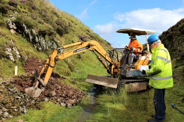 Lowthers Railway Society chairman Alex Mackie supervises the digging of the first trial pit. Picture: Hugh Dougherty