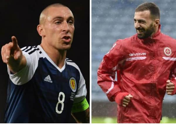 Scott Brown, left, accused Malta defender Steve Borg, right, of spitting at him. Pictures: SNS/Getty Images