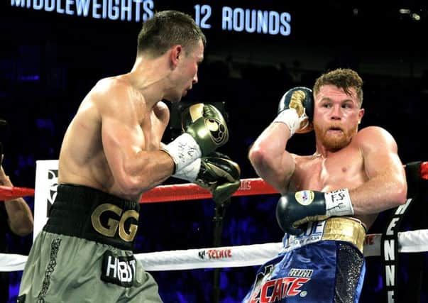 Canelo Alvarez, right, on the defensive during Saturday nights Las Vegas bout with Gennady Golovkin. Picture: AFP/Getty.