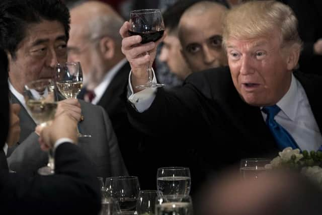 US President Donald Trump raises his glass to a toast by UN Secretary-General Antonio Guterres. Picture: AFP/Getty Images