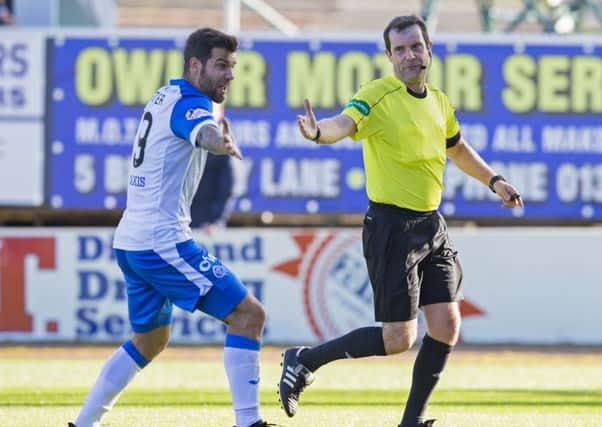 Ricky Foster remonstrates with referee Alan Muir after a penalty is given against the full-back. Picture: SNS