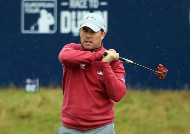 Richie Ramsay reacts after missing a putt on the 18th. Picture: Andrew Redington/Getty Images