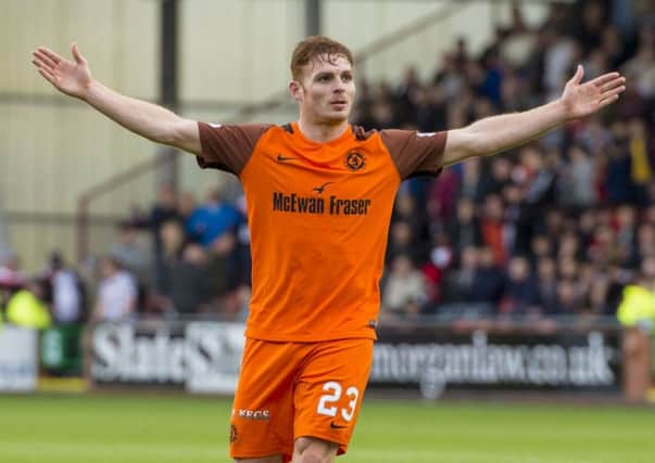 Fraser Fyvie celebrates scoring Dundee Uniteds third goal. Picture: SNS.