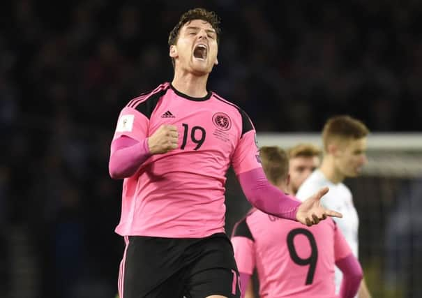 Scotlands Chris Martin, who put Martin Skrtel under pressure and forced him to turn the ball into the Slovakia net, celebrates. Picture: Rob Casey/SNS