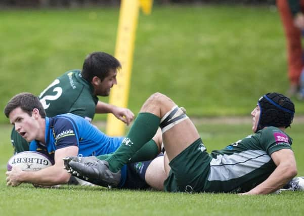 Boroughmuirs stand-off Greg Cannie touches down for a try he then converted.  Photograph: Graham Stuart/SNS