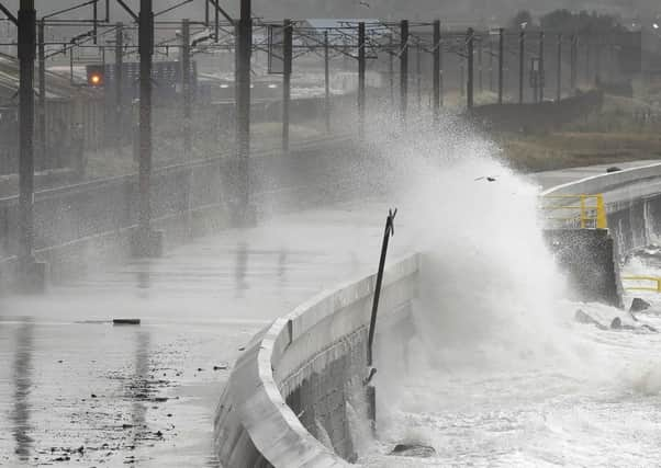 Waves crash over the breakwater as the remnants of Hurricane Ophelia hit Saltcoats on the west coast of Scotland on the morning of 17th October 2017.
 Picture; Getty