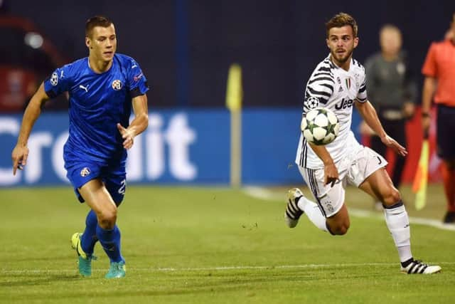 Filip Benkovic, left, vies with Juventus midfielder Miralem Pjanic during a Champions League match in September 2016. Picture: AFP/Getty Images