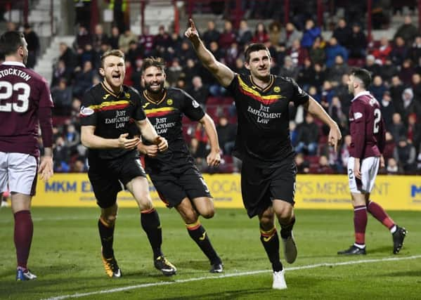 Kris Doolan celebrates his late equaliser for Partick Thistle. Picture: SNS