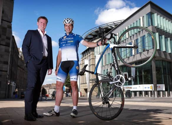 Marshall Dallas with adventure cyclist Mark Beaumont. Picture: Stewart Attwood