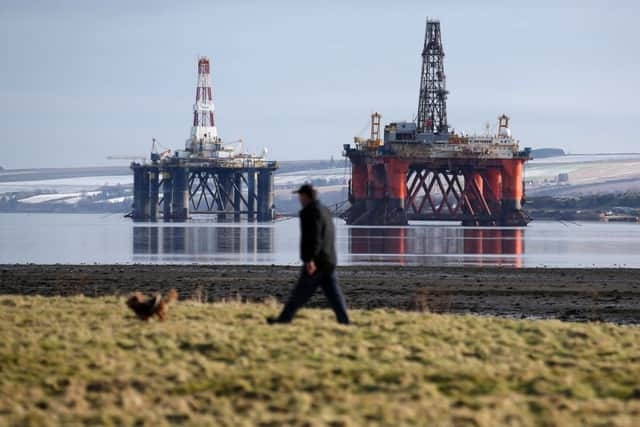 Oil platforms stand amongst other rigs laid-up in the Cromarty Firth near Invergordon in the Highlands. Picture: Andrew Milligan/PA Wire