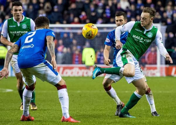 Hibs winger Brandon Barker, right, gave 
Rangers full-back James Tavernier 
(No 2) a torrid time. Picture: Ross Parker/SNS