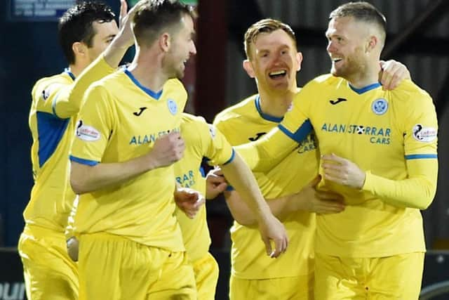 St Johnstone's Denny Johnstone, right,celebrates after opening the scoring.