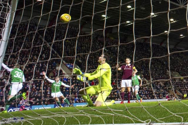 Jon McLaughlin watches on as Oli Shaw (left) sees his flicked effort adjudged not to have crossed the goal-line. Picture: SNS Group