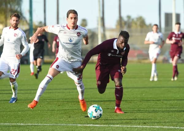 Hearts' Esmael Goncalves, right, competes with Nurnberg's Georg Margreitter. Picture: Craig Foy/SNS