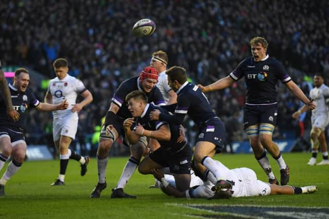 Huw Jones is congratulated after scoring the third try. Picture: Getty images