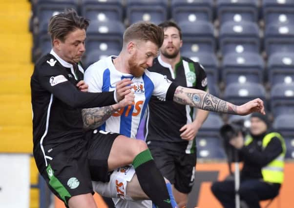 Kilmarnock's Alan Power (right) battles with Hibs midfielder Scott Allan. Picture: SNS