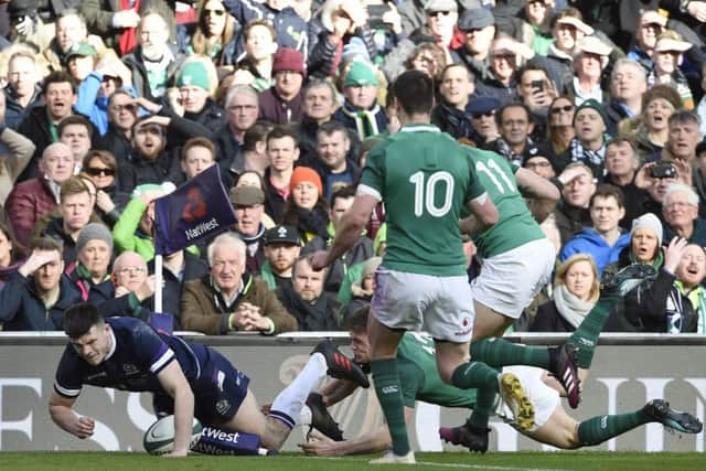 Blair Kinghorn, starting his first Test match for Scotland, scores Scotlands only try with a brilliant finish in the corner. Picture: Ian Rutherford