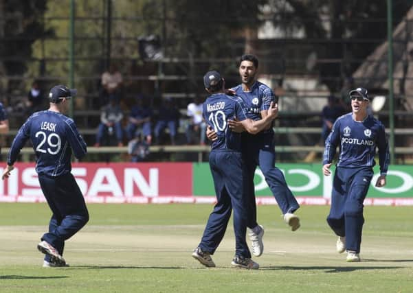 Scotland celebrate the wicket of West Indies batsman Chris Gayle at Harare Sports Club. Picture: AP Photo/Tsvangirayi Mukwazhi