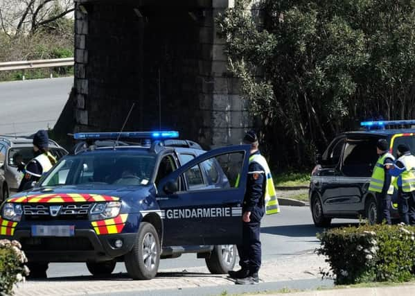 French police block an access to Trebes, where a man took hostages at a supermarket. Pic: AFP/Getty